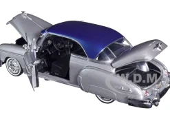 1950 Chevrolet Bel Air Lowrider Silver Metallic Blue Metallic Top Get Low Series 1/24 Diecast Model Car Motormax 79026