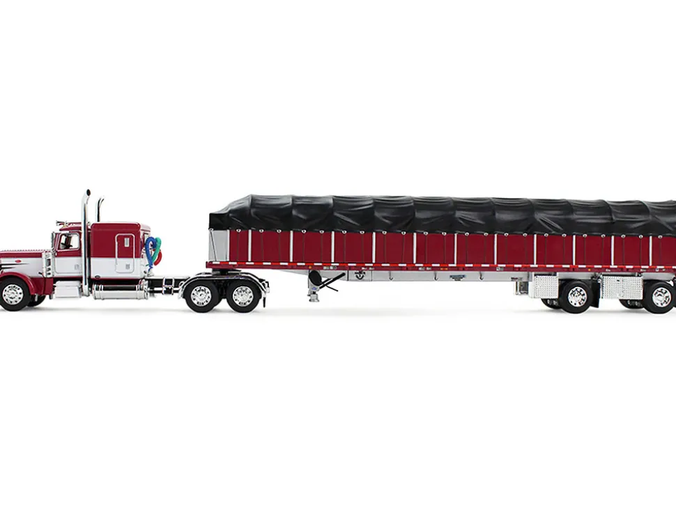 Peterbilt 389 with 63" Flat Top Sleeper and 53’ Wilson Roadbrute Flatbed Trailer with Covered Wagon Maroon with White Stripes 1/64 Diecast Model by DCP/First Gear